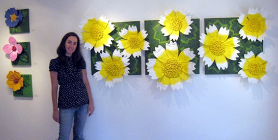 Jennifer with her flower paintings